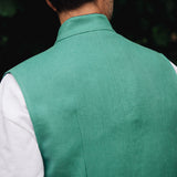 Man wearing a Darzi green vest over a white shirt - focused on back