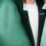 Jade green Darzi Como linen waistcoat with navy contrast lining