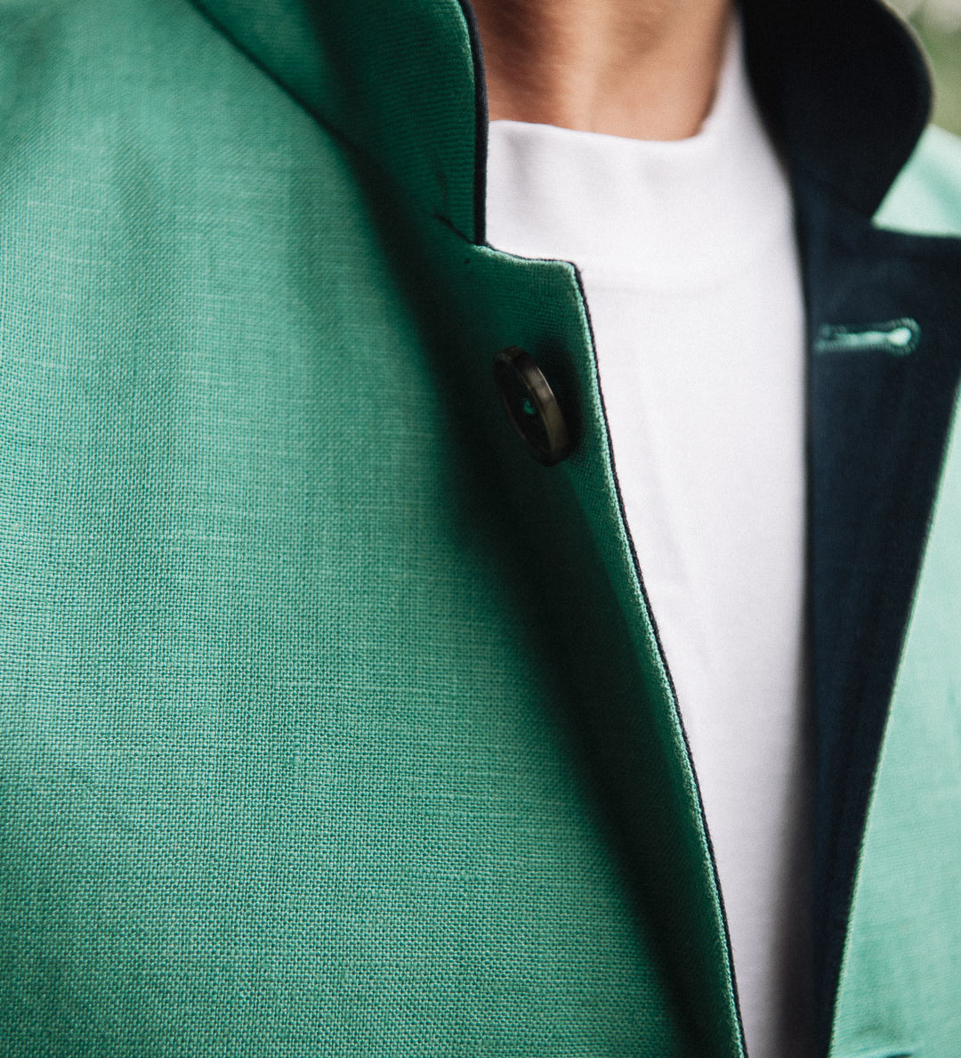 Jade green Darzi Como linen waistcoat with navy contrast lining