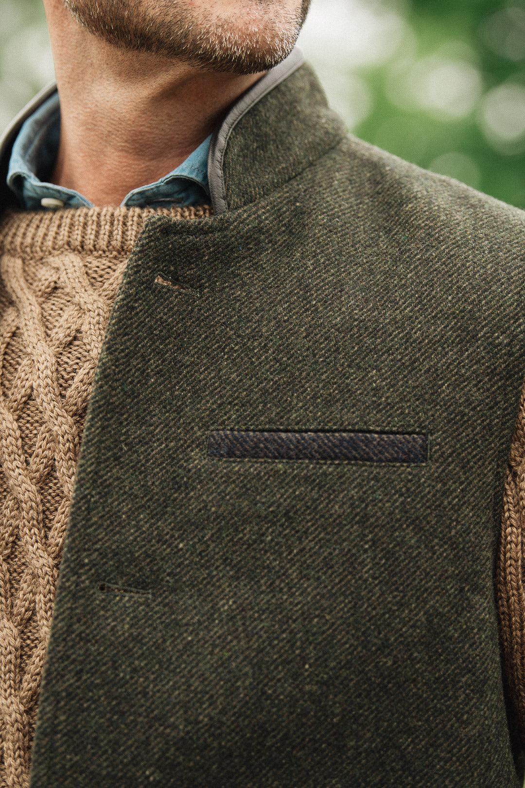 Close-up breast pocket detail of Darzi Helmsley green brown twill wool waistcoat
