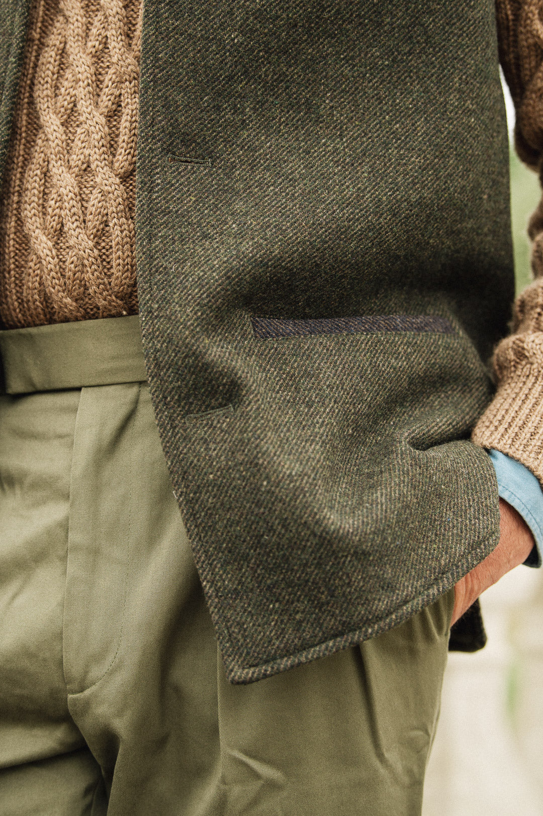 Close-up side pocket detail of Darzi Helmsley green brown twill wool waistcoat