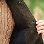 Close-up detail showing internal fleece lining of Darzi Helmsley green brown twill wool waistcoat