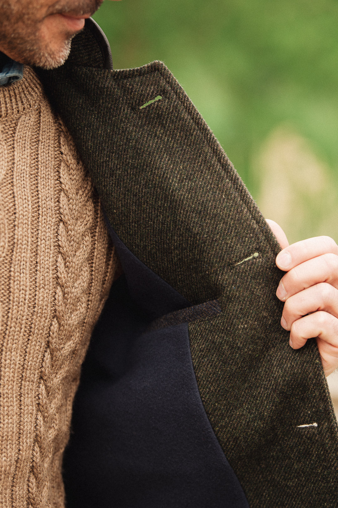 Close-up detail showing internal fleece lining of Darzi Helmsley green brown twill wool waistcoat