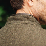 Close-up collar detail of Darzi Helmsley green brown twill wool waistcoat, shown from behind