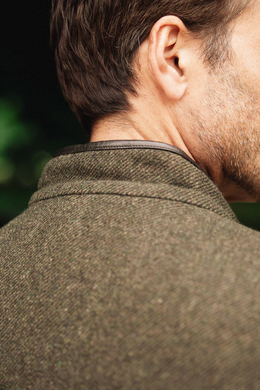 Close-up collar detail of Darzi Helmsley green brown twill wool waistcoat, shown from behind