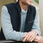 Man wearing a light blue sweater and Darzi Midnight Blue merino wool waistcoat 