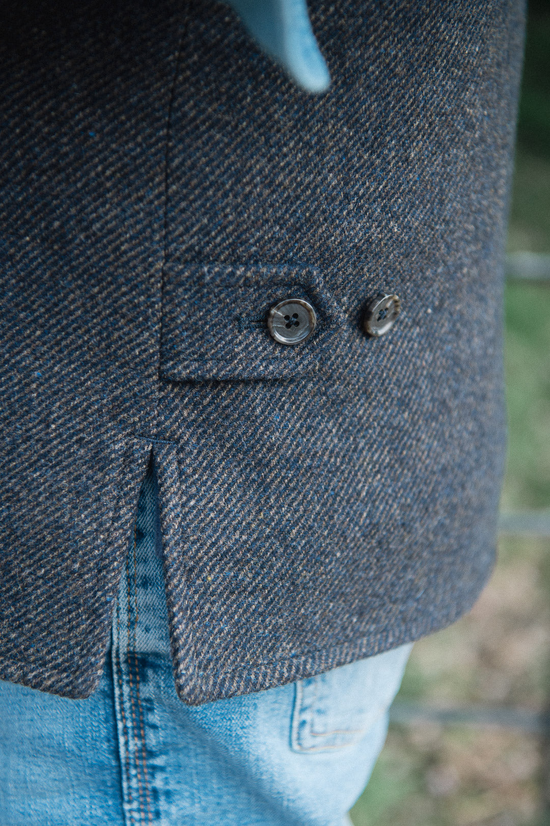 Close-up of waist adjuster detail on Darzi Helmsley wool waistcoat in Blue Brown Twill 
