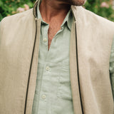 Close up of Darzi limestone linen Hillgate gilet with green trim