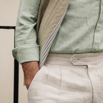Person wearing a Darzi limestone linen gilet - close-up of cotton lining detail