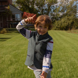 Boy wearing Little Darzi gilet in Deep Teal